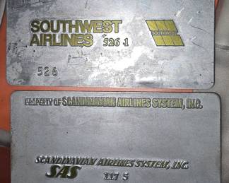Dozens of vintage Airline Ticket validation plates