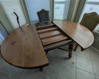 Magnolia Chairs and dinning room table with fold out leaf in the middle