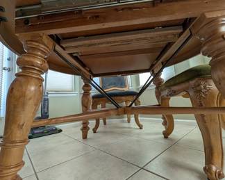 Magnolia Chairs and dinning room table with fold out leaf in the middle
