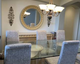 Large glass table top dinning room set with matching buffett, end tables, coffee table and entry table and mirror