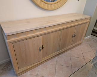 Large glass table top dinning room set with matching buffett, end tables, coffee table and entry table and mirror