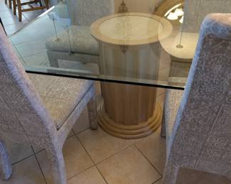 Large glass table top dinning room set with matching buffett, end tables, coffee table and entry table and mirror