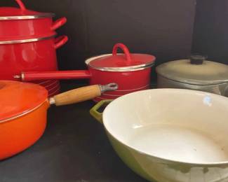 Four Copco And One LeCreuset Stove Top Pans