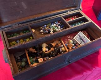 Vintage chest with marbles, cards, chess pieces