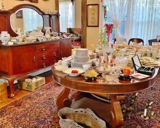 Antique Cherrywood Dining Room table with 4 leaves and 10 chairs loaded with china and pottery