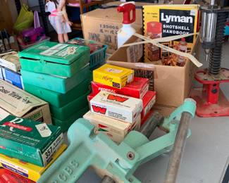 Empty cartridge shells and misc. gun equipment