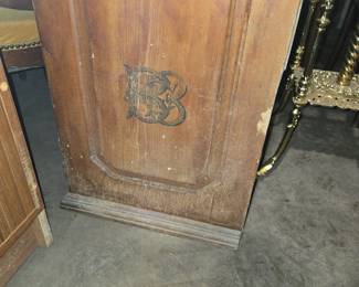 side of spool cabinet showing logo