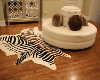 Zebra motif hide rug & banquette settee center sofa