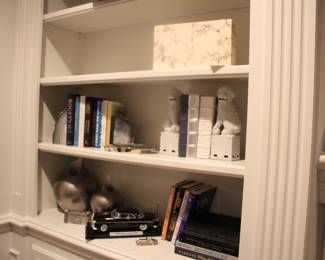 Assorted books, foo dog bookends