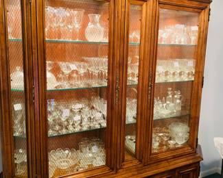 lighted china cabinet filled to the top with Imperical crystal