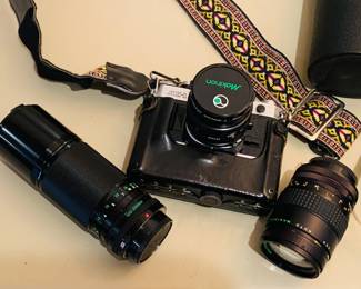 Canon AE 1 film camera with several lenses