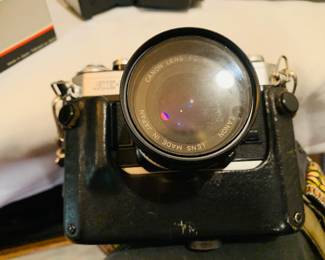 Canon film camera with several lenses