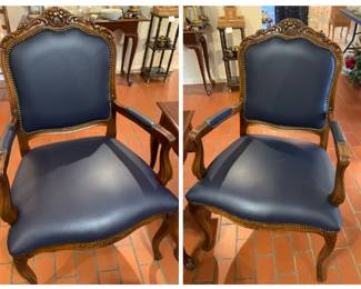 pair of perfect leather and carved wood arm chairs by Harris Marcus