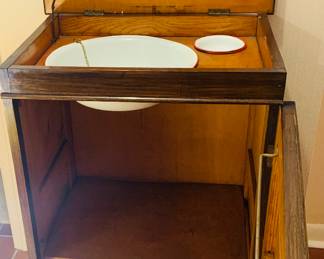 early 20th century wash stand that's opened