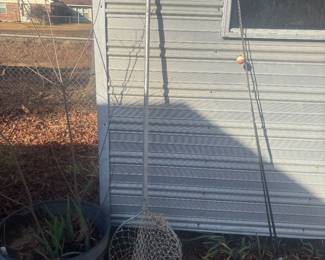 Plant, fishing rod and net. Building not for sale.