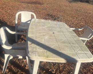 Plastic patio table and 3 chairs