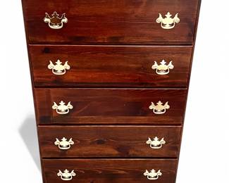 This is a traditional 5- drawer cherry wood chest with brass handles
