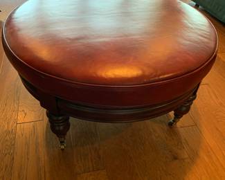 Bassett leather ottoman on wheels in perfect shape.
