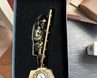 This is a beautiful and HEAVY Vintage Solid Brass Fireman Rescue Figure with Mini Clock! The clock is made by SANIS in Japan! This piece comes with its original box and all paperwork! MINT!  