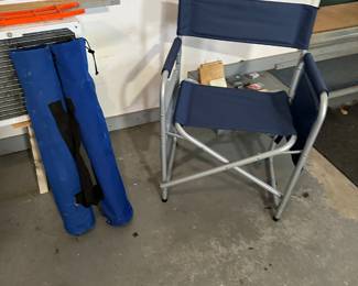 Two folding chairs and a great cooler”directors” style folding chair! 