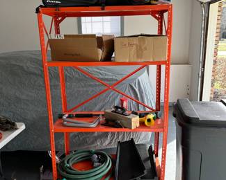 The orange shelf is for sale! Hoses, yard equipment and bike accessories! 