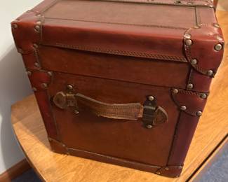 This is a great little side piece! A small leather covered trunk. Lined, and in near mint condition! 