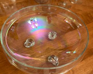 I LOVE this crystal bowl! It is footed with three feet and has a stunning iridescent shine to it.  