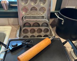 Cake Pans, Cookie sheets and muffin tins! OH MY! Also a great LARGE electric skillet! The rolling pin is cool too, it has great shiny metal handles!