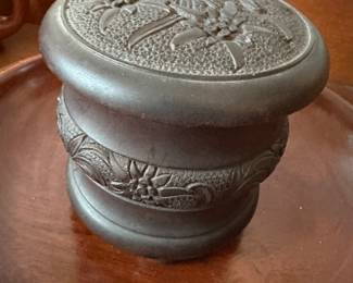 This is a dark wooden round box with music box! 
