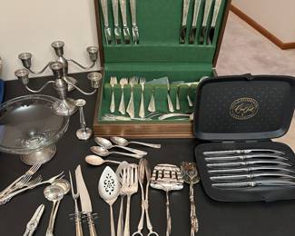 Sterling compote, Candelabras, and a 64 piece set of Sterling Flatware. 