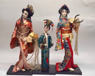 Three Japanese Geisha Figurine Dolls on Wood