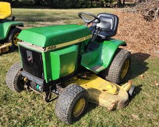 19.9HP Kohler 879cc, 2-Cylinder, gasoline, air-cooled, horizontal shaft, opposed twin. 1,485
hours showing on the hour meter (accuracy unknown). Sundstrand hydrostatic transmission,
two speed differential, power steering, three hydraulic circuits, split brakes, three-point hitch.
The PTO is belt driven. Includes 60β mid-mount mower deck, digital format John Deere shop
manual, shaft driven 46β snow thrower with hydraulic directional chute control. There is a Sears
8 hp, rear roto tiller that has been adapted to the tractorβs three-point hitch.
This machine is in fair cosmetic condition. The headlight lens and bulb sockets are missing. The
tractor has had the differential replaced, new head gaskets installed, new breather element, and
some work done on the power steering control valve. The engine and drivetrain work well. The
hydraulics need further work, especially the three-spool control valve.
