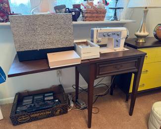 	#38	Kenmore sewing machine with cabinet, case, and accessories	 $60.00 				