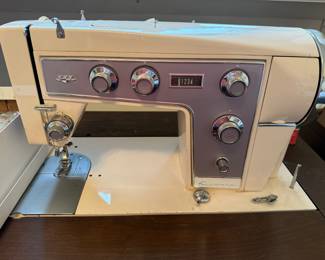#38	Kenmore sewing machine with cabinet, case, and accessories	 $60.00 					