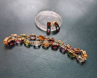 A 14kt gemstone oval gemstone bracelet with matching earrings 