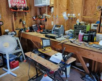 Tool shed packed with a selection of hand and power tools.