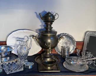 Nice collection of cut glass, Sterling coasters, silver plate and shell placements. 