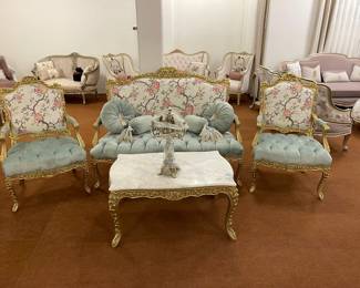 Elegant Louis XVI Style Salon Set: Settee & Armchairs with Exquisite Carvings and Floral Upholstery