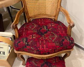 $400. Lovely caned chair with footstool upholstered in the same fabric.  not 100% matching the feet are different.  22 inches wide by 20 inches deep by 33 inches high.  Available for online purchase per the instructions on the sale details page, pickup is during in-person shopping hours.