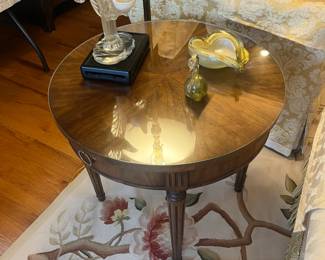 $190. Kindel furniture company one drawer round side table with a glass top. 24.5 inches in diameter by 22.5 inches high.  Available for online purchase per the instructions on the sale details page, pickup is during in-person shopping hours.