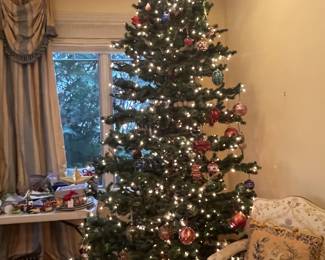 $100   An artificial white light Christmas tree approximately 9’5” high.