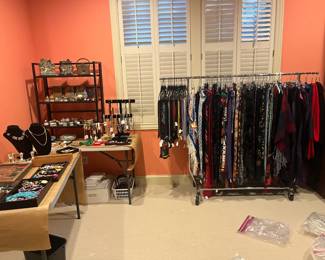 Designer scarves and bags available for purchase during in-person shopping on Friday and Saturday.