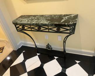 $240. Marble top ion iron base wall mounted console.  43"w x 13.75"d x 33.5"h.  Available for online purchase per the instructions on the sale details page, pickup is during in-person shopping hours.