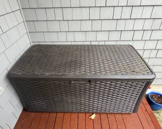 $80. Outdoor wicker cushion storage by Suncast.  56"w x 28.5"d x 26"h