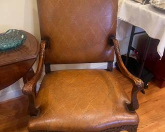 $980.   A  beautiful carved wood and leather upholstered side chair with beautiful detail on the arms. A close-up photo of the leather will show the wonderful detailing in the Leather as well.  28.5 inches wide by 28 inches deep by 45 inches high.  Available for online purchase per the instructions on the sale details page, pickup is during in-person shopping hours.