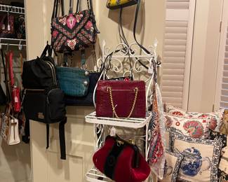Designer handbags available for purchase during in-person shopping on Friday and Saturday.