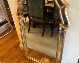$420. Gilded mirror with architectural styling. 26 inches wide by 43.5 inches high.  Available for online purchase per the instructions on the sale details page, pickup is during in-person shopping hours.