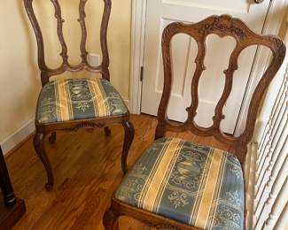 $280. Set a four carved wood chairs with blue and white upholstery perfect for a game table! each chair is 18 inches wide by 17 inches deep by 38.5 inches high. 
 Available for online purchase per the instructions on the sale details page, pickup is during in-person shopping hours.