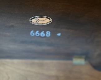 Brandt stamp on the under side of the library stand.