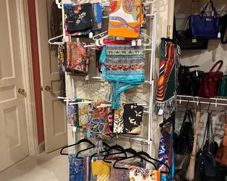 Designer scarves and bags available for purchase during in-person shopping on Friday and Saturday.